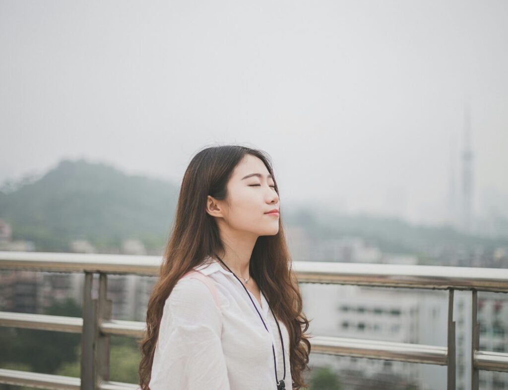 Asian Woman On Balcony